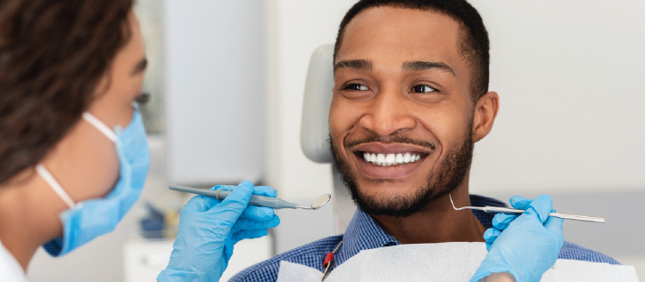 Young man smiling at the dentist