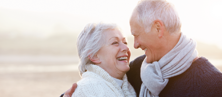 Senior couple looking at each other smiling affectionately