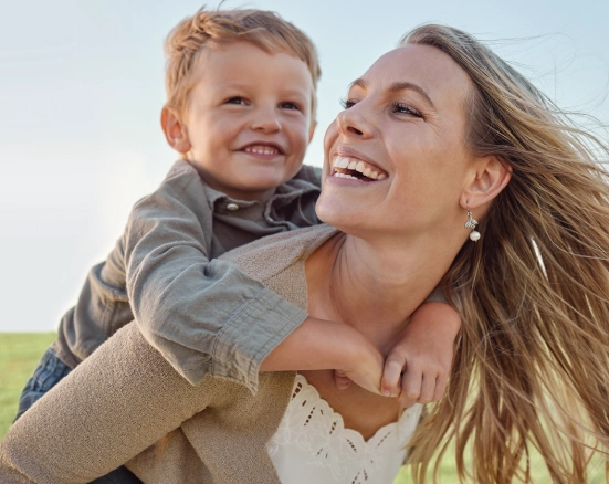 Mom and son outside smiling