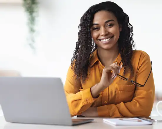 A woman smiling while shopping for full coverage dental insurance