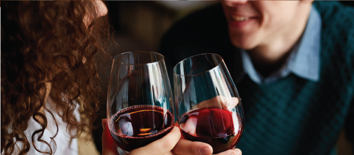 Two people drinking red wine together