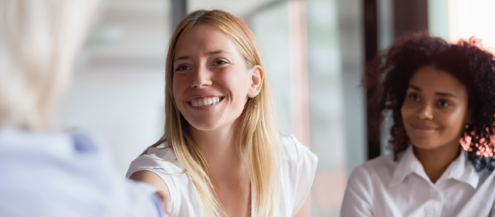 A young woman smiling while wearing contacts