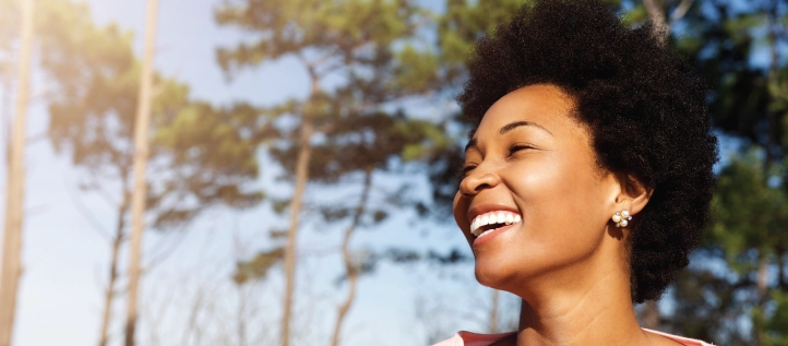 Young woman outside smiling