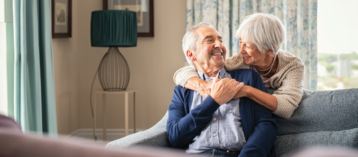 Senior couple hugging and happy to have Spirit Dental full coverage