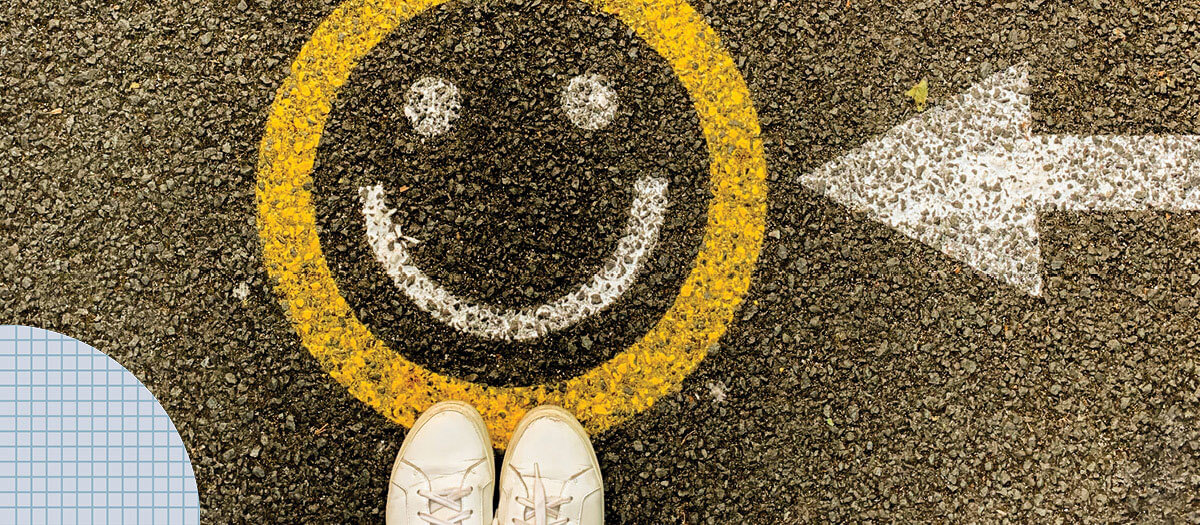 Smiley face painted on pavement