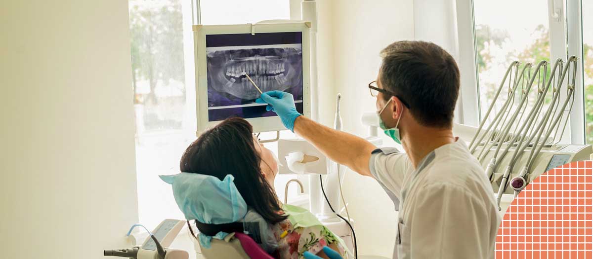 Dentist showing patient their x-rays