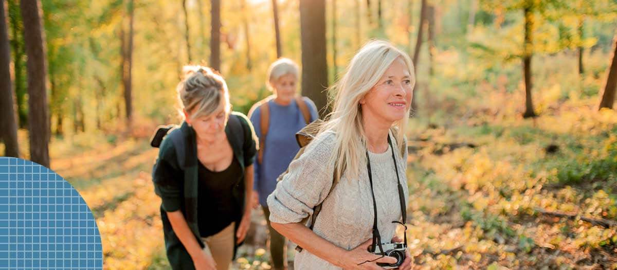 Three omen on a hike with cameras