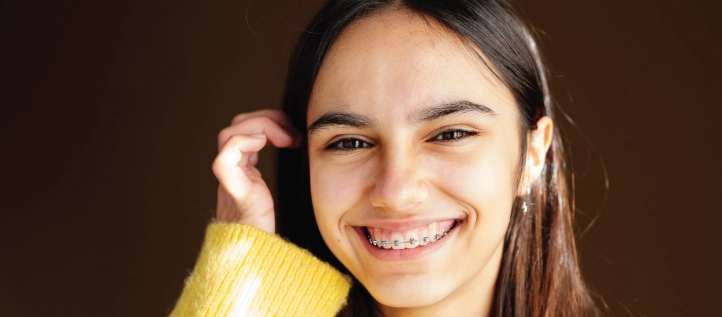 Young girl smiling with braces