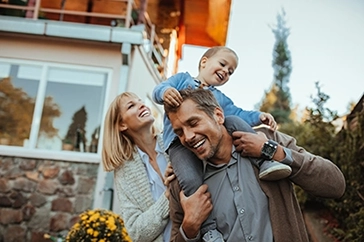 Image of family smiling and having fun