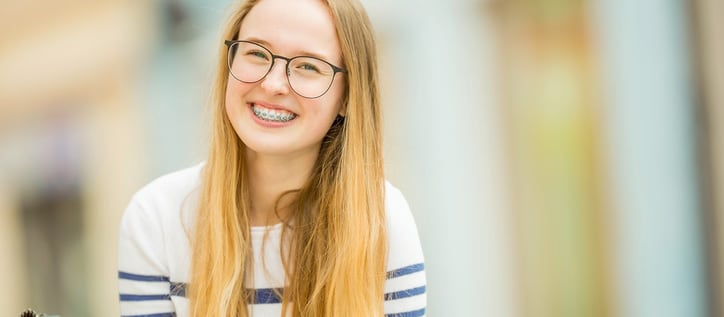 Childrens Orthodontics Girl with braces smiling at camera