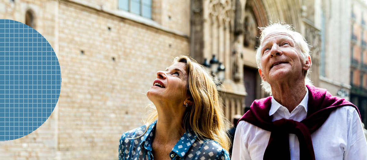 Elderly couple walking and looking up